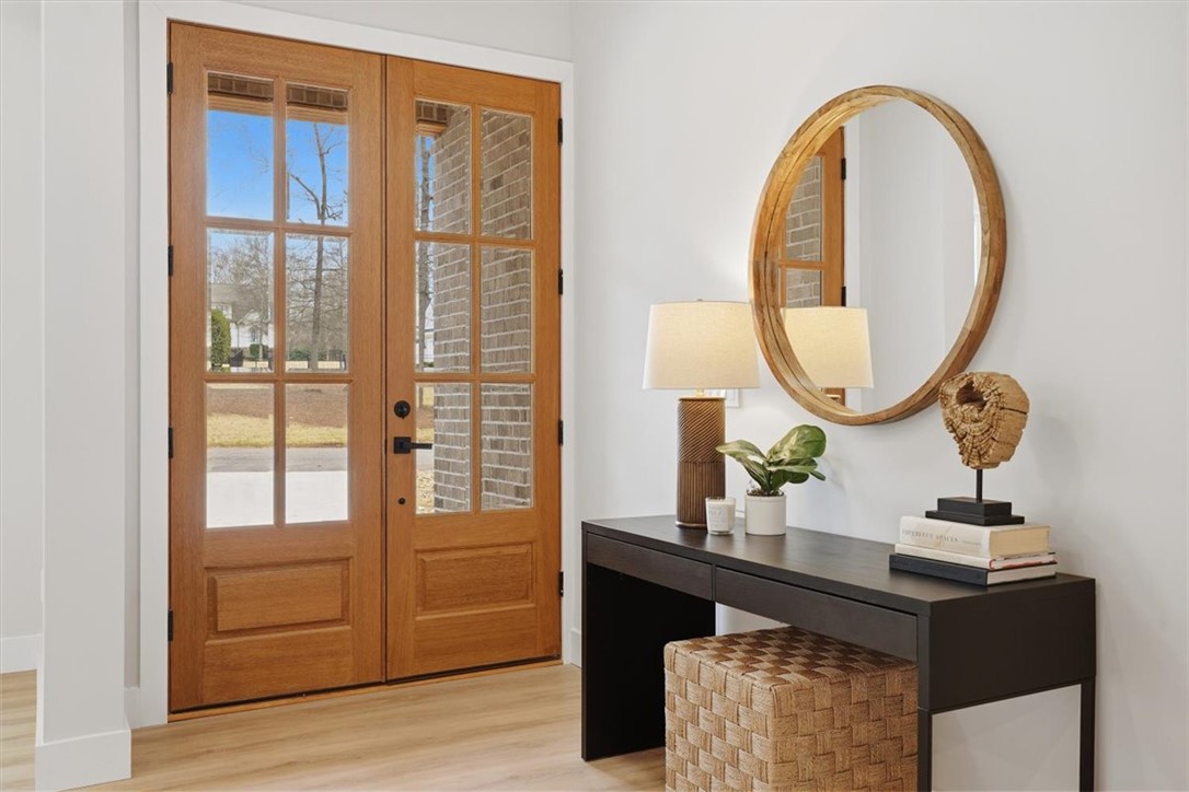 304 Avenue Of Oaks Anderson, SC 29621 - Photo 3 of 38 Step inside through the elegant French doors to a bright and inviting entry.