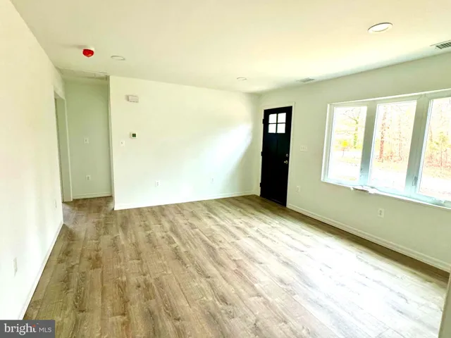 a view of an empty room and window