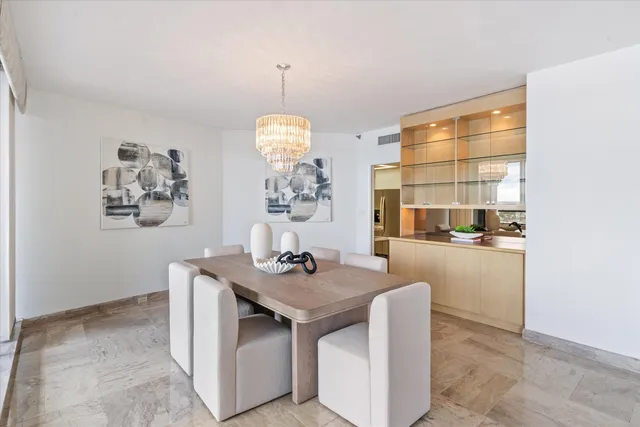 a dining table sitting next to a window