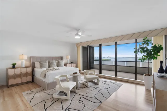 a bedroom with a balcony a bed and a couch