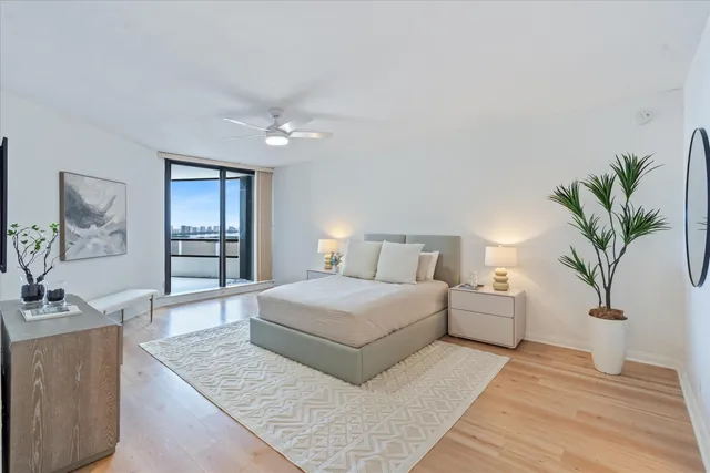 a spacious bedroom with a large bed and a couch