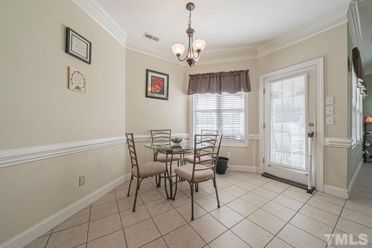 11563 Rockside Road Middlesex, NC 27557 - Photo 14 of 53 a dining room that has a window and a table in it
