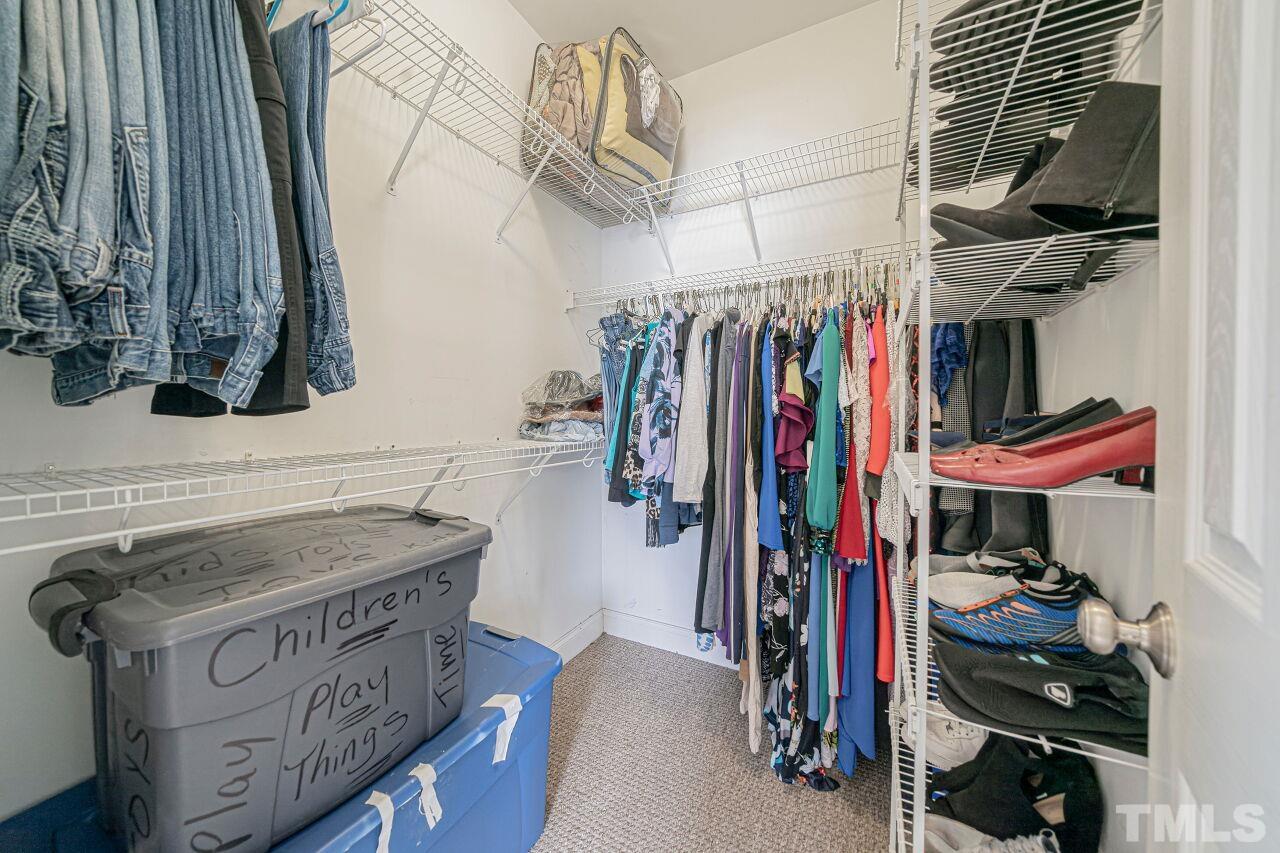 11563 Rockside Road Middlesex, NC 27557 - Photo 37 of 53 a view of walk in closet with clothes and shoes
