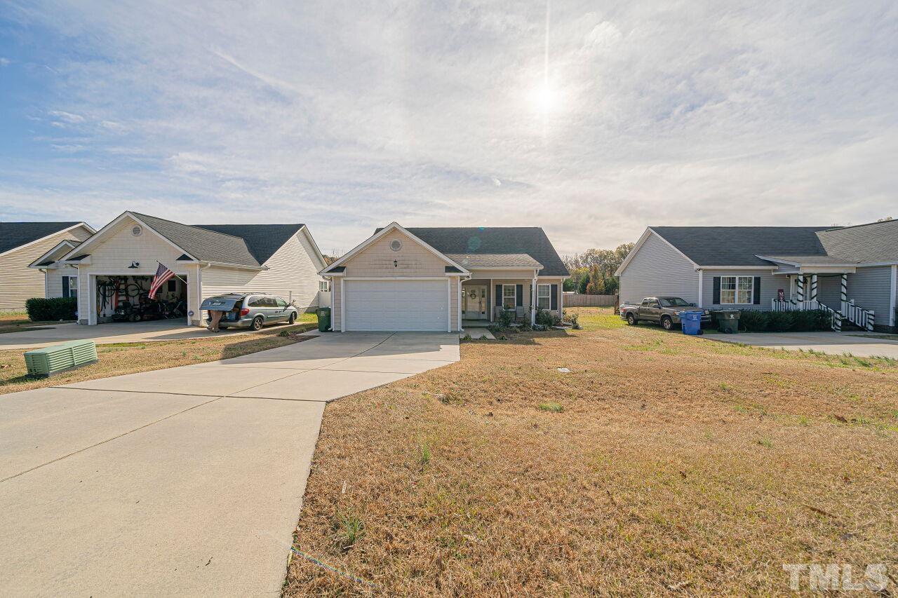 11563 Rockside Road Middlesex, NC 27557 - Photo 38 of 53 a front view of a house with a yard and garage