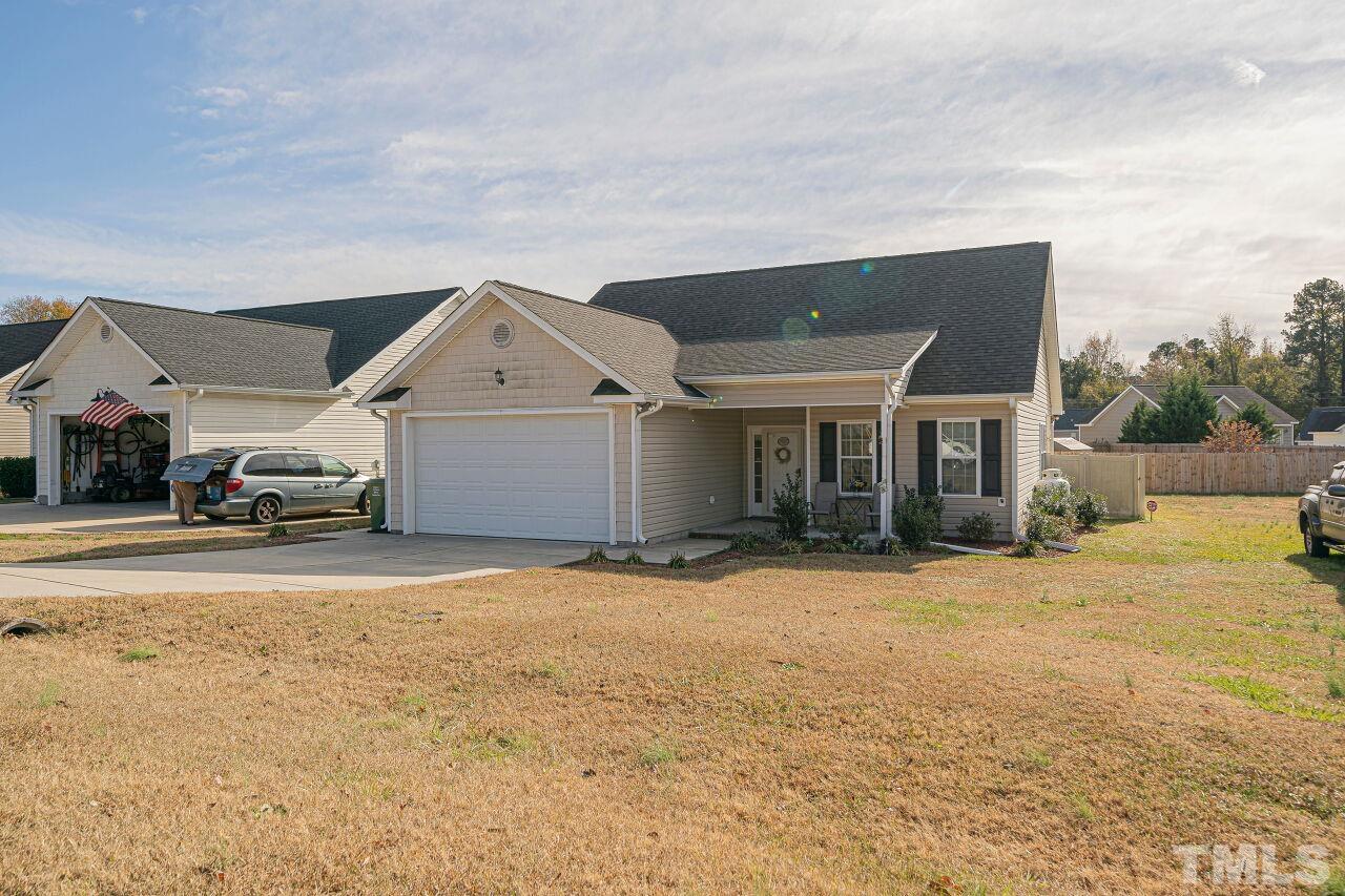 11563 Rockside Road Middlesex, NC 27557 - Photo 39 of 53 a front view of a house with a yard and garage