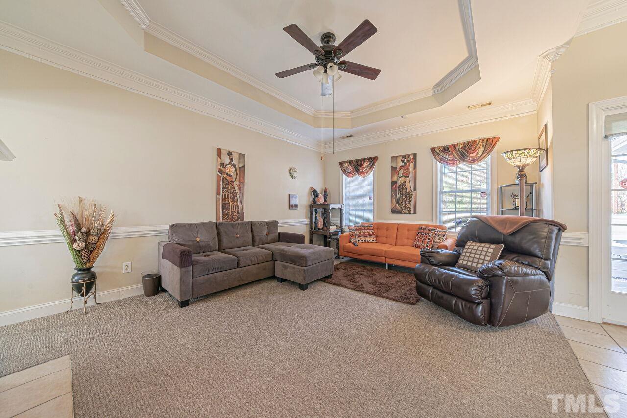 11563 Rockside Road Middlesex, NC 27557 - Photo 5 of 53 a living room with furniture and a chandelier