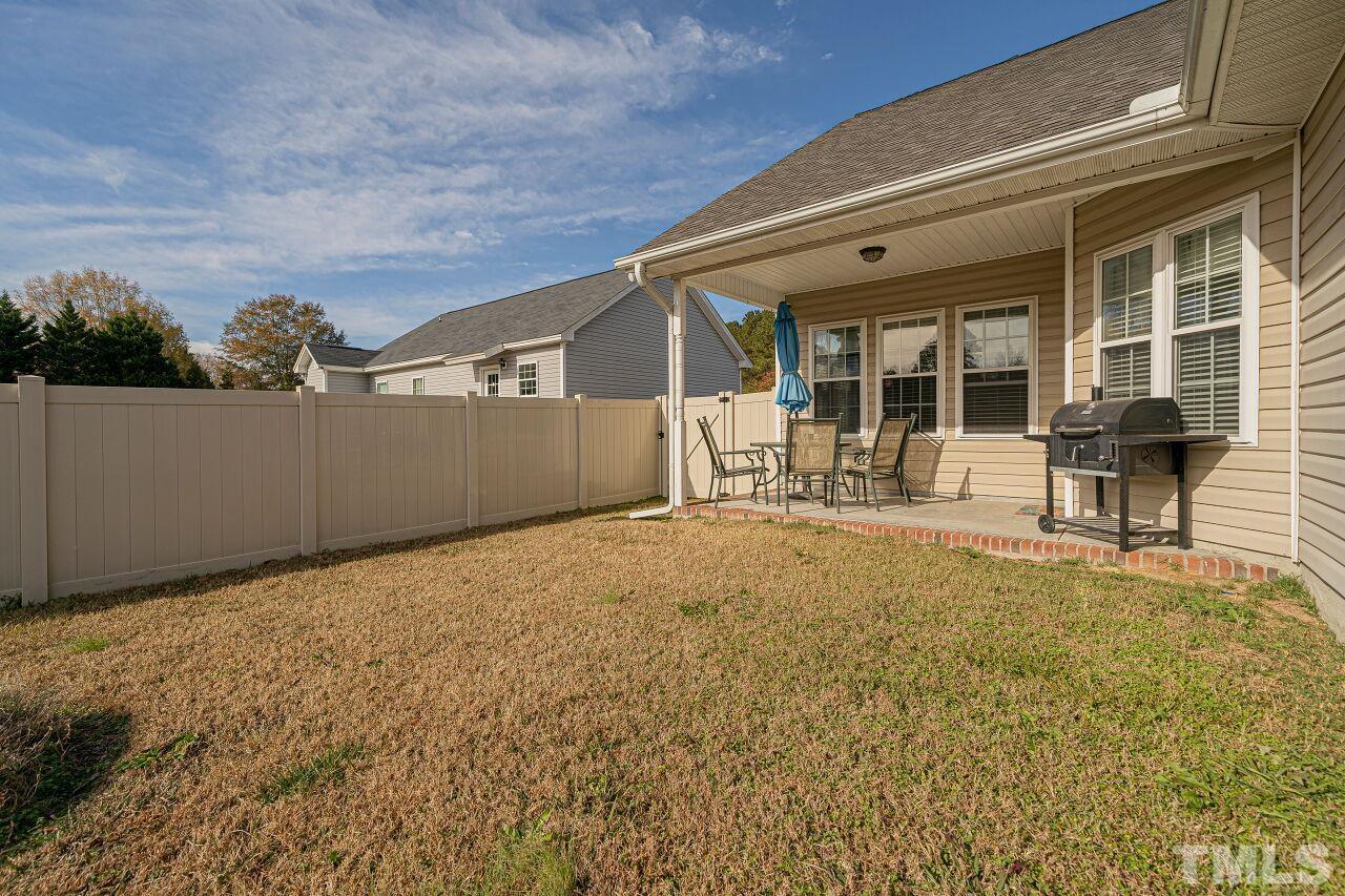 11563 Rockside Road Middlesex, NC 27557 - Photo 53 of 53 a backyard of a house with yard and outdoor seating