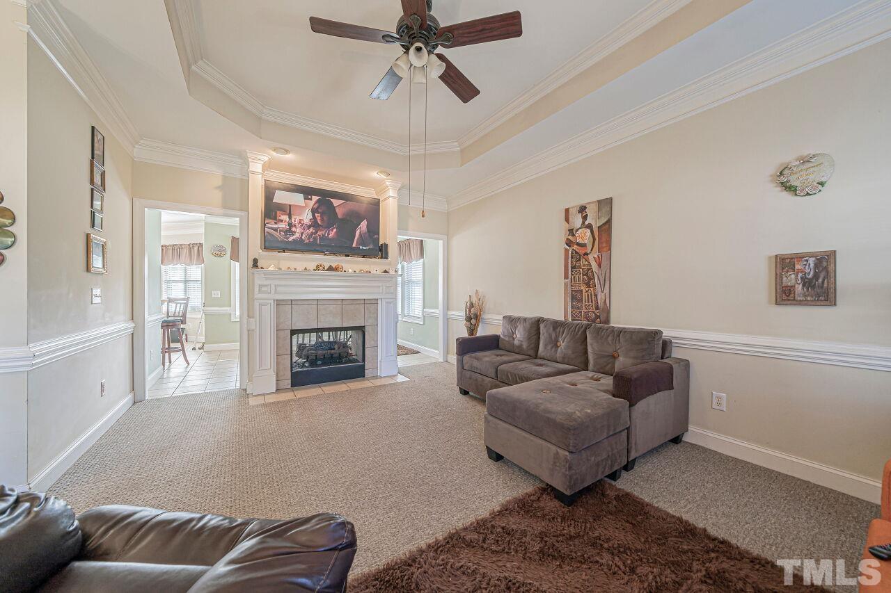 11563 Rockside Road Middlesex, NC 27557 - Photo 9 of 53 a living room with furniture and a fireplace