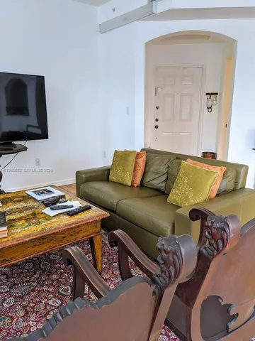 a living room with a couch and a flat screen tv