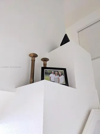 a bedroom with a bed and a mirror