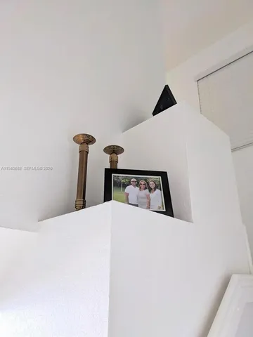 a bedroom with a bed and a mirror