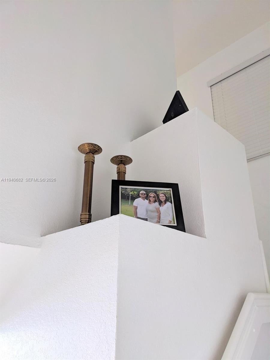 8930 West Flagler Street, Unit 201 Miami, FL 33174 - Photo 7 of 20 a bedroom with a bed and a mirror