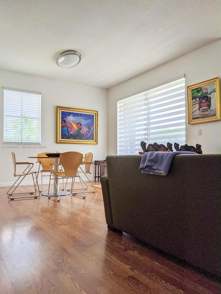 8930 West Flagler Street, Unit 201 Miami, FL 33174 - Photo 10 of 20 a living room with furniture and a large window