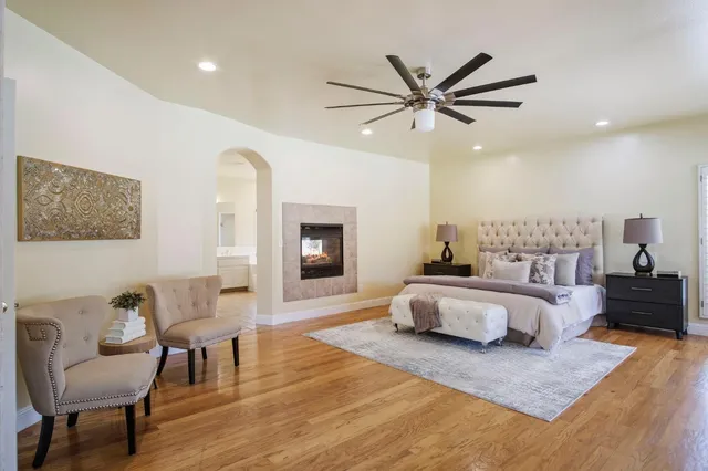 a spacious bedroom with a bed and a couch