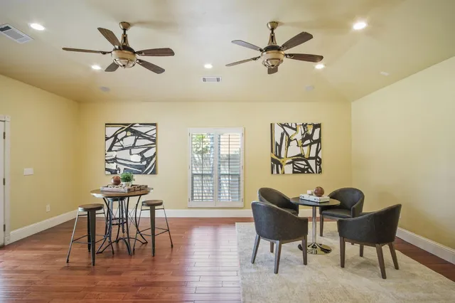 a workspace with furniture window and wooden floor