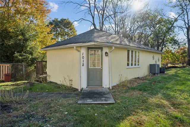a kitchen that has a refrigerator and a sink