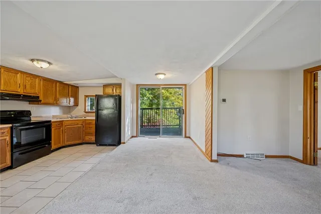a view of an empty room with glass door