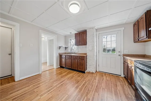 a kitchen with stainless steel appliances a white stove top oven and a refrigerator