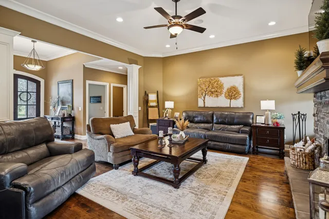 a living room with furniture and a rug