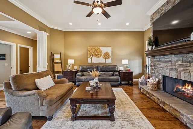 a living room with furniture and a fireplace