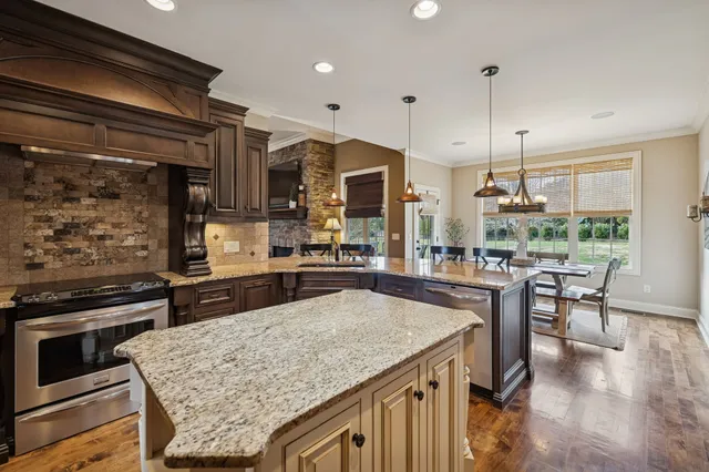 a kitchen with a table and chairs in it