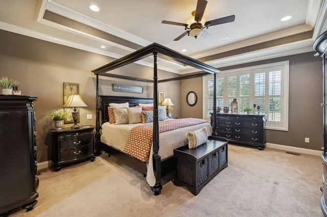 a spacious bedroom with a bed and window