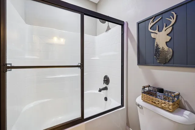 a bathroom with a bathtub and shower