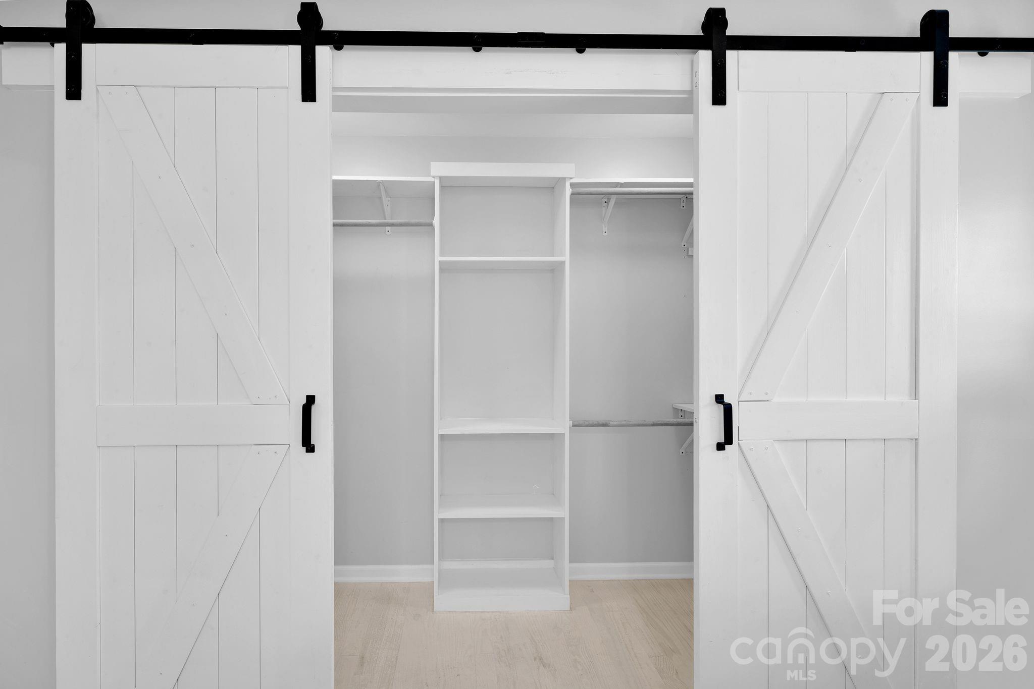 1252 Houston Mill Road Conover, NC 28613 - Photo 22 of 43 a view of walk in closet with empty racks