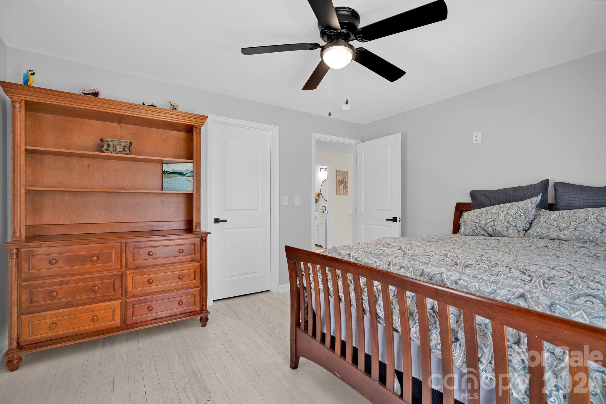 1252 Houston Mill Road Conover, NC 28613 - Photo 24 of 43 a bedroom with a bed and a dresser