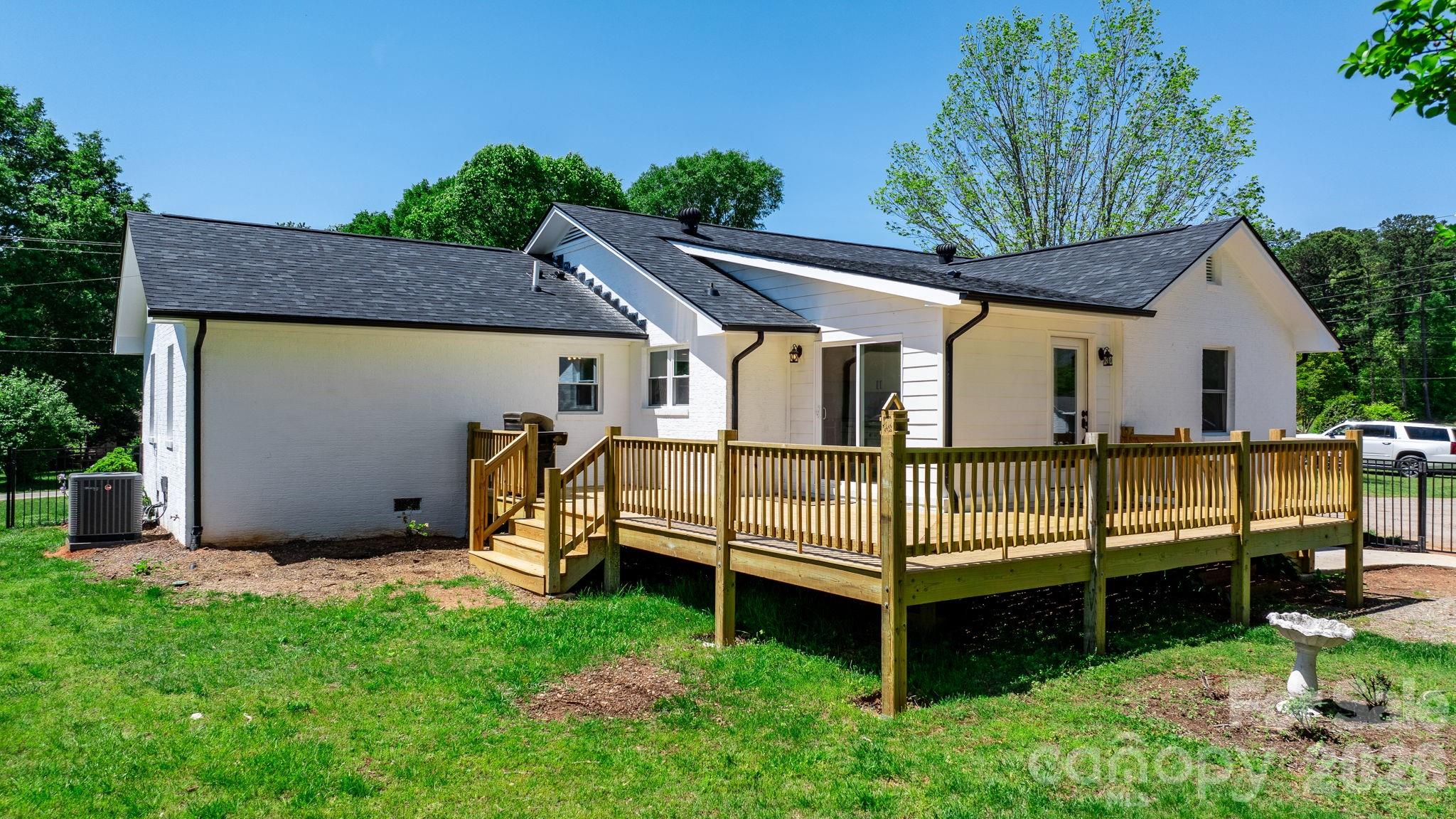 1252 Houston Mill Road Conover, NC 28613 - Photo 30 of 43 a view of backyard with a garden and deck