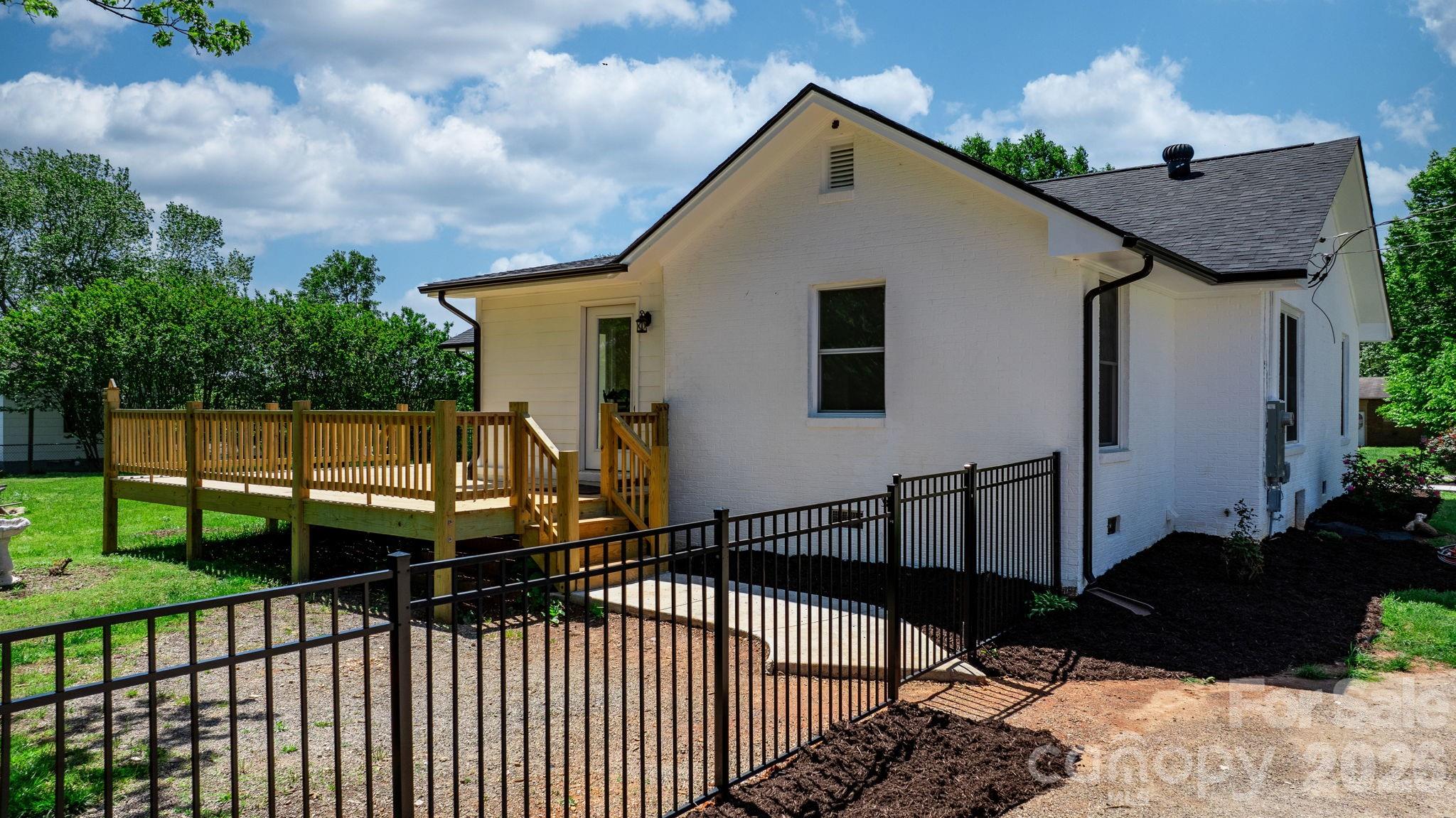 1252 Houston Mill Road Conover, NC 28613 - Photo 32 of 43 a view of house with backyard and sitting area