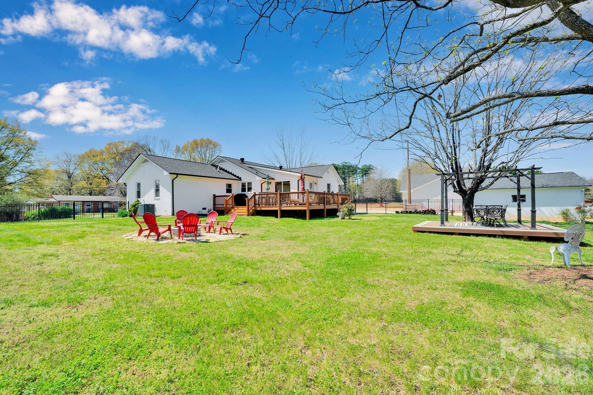 1252 Houston Mill Road Conover, NC 28613 - Photo 41 of 43 a front view of a house with garden and tree