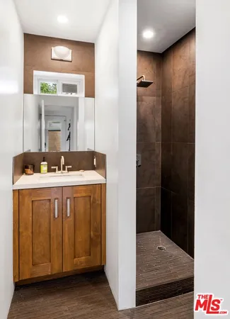 a bathroom with a sink and a mirror