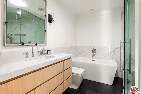 a bathroom with a sink and a large mirror