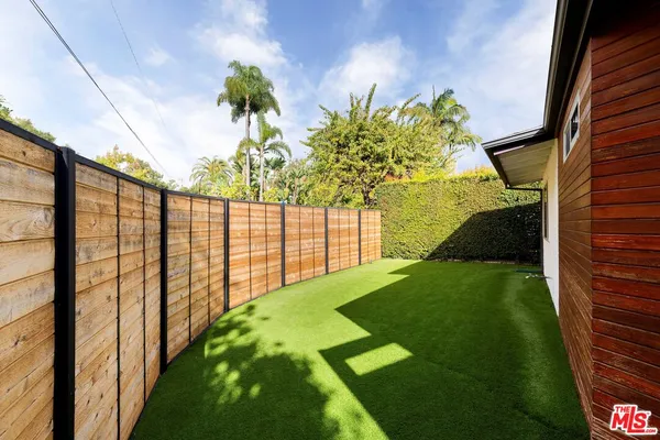 a view of a garden with a flower pot