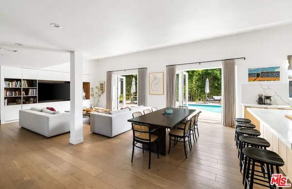 a living room with fireplace furniture and a flat screen tv