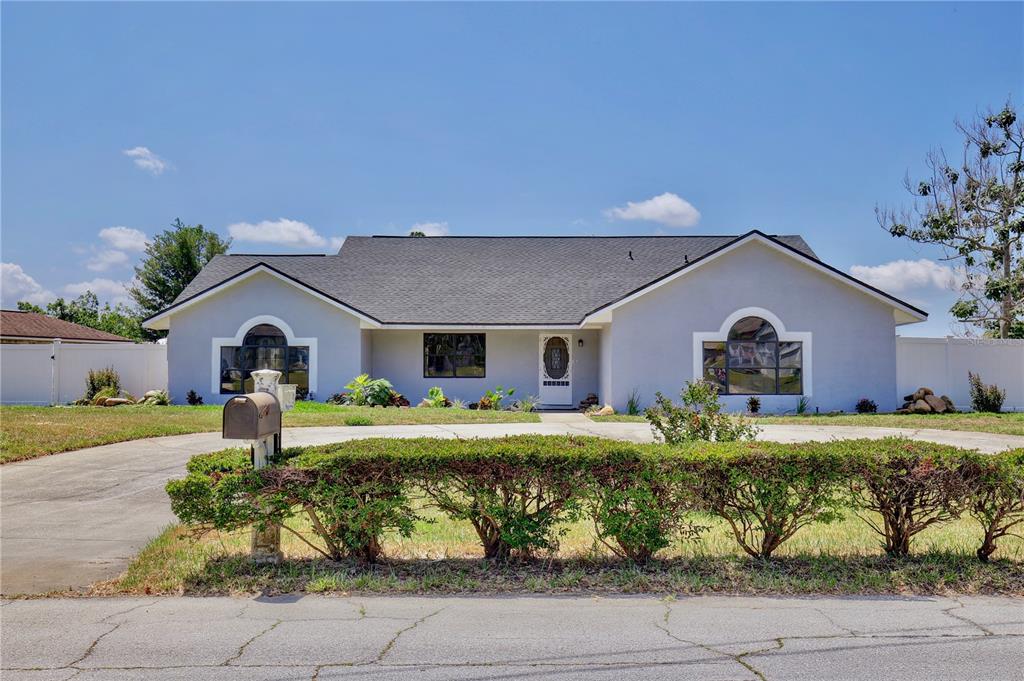 2411 Fountain Road Deltona, FL 32738 - Photo 1 of 1 a front view of a house with garden