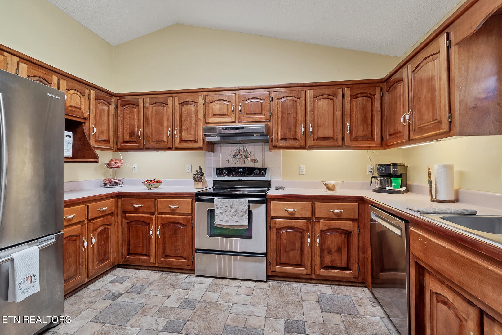 449 Foss Road Maryville, TN 37801 - Photo 21 of 49 a kitchen with stainless steel appliances granite countertop a refrigerator sink and cabinets