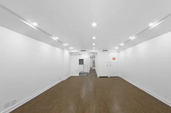 an empty room with a empty space and window