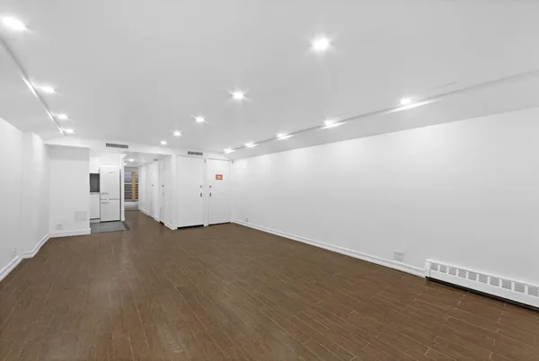 an empty room with wooden floor