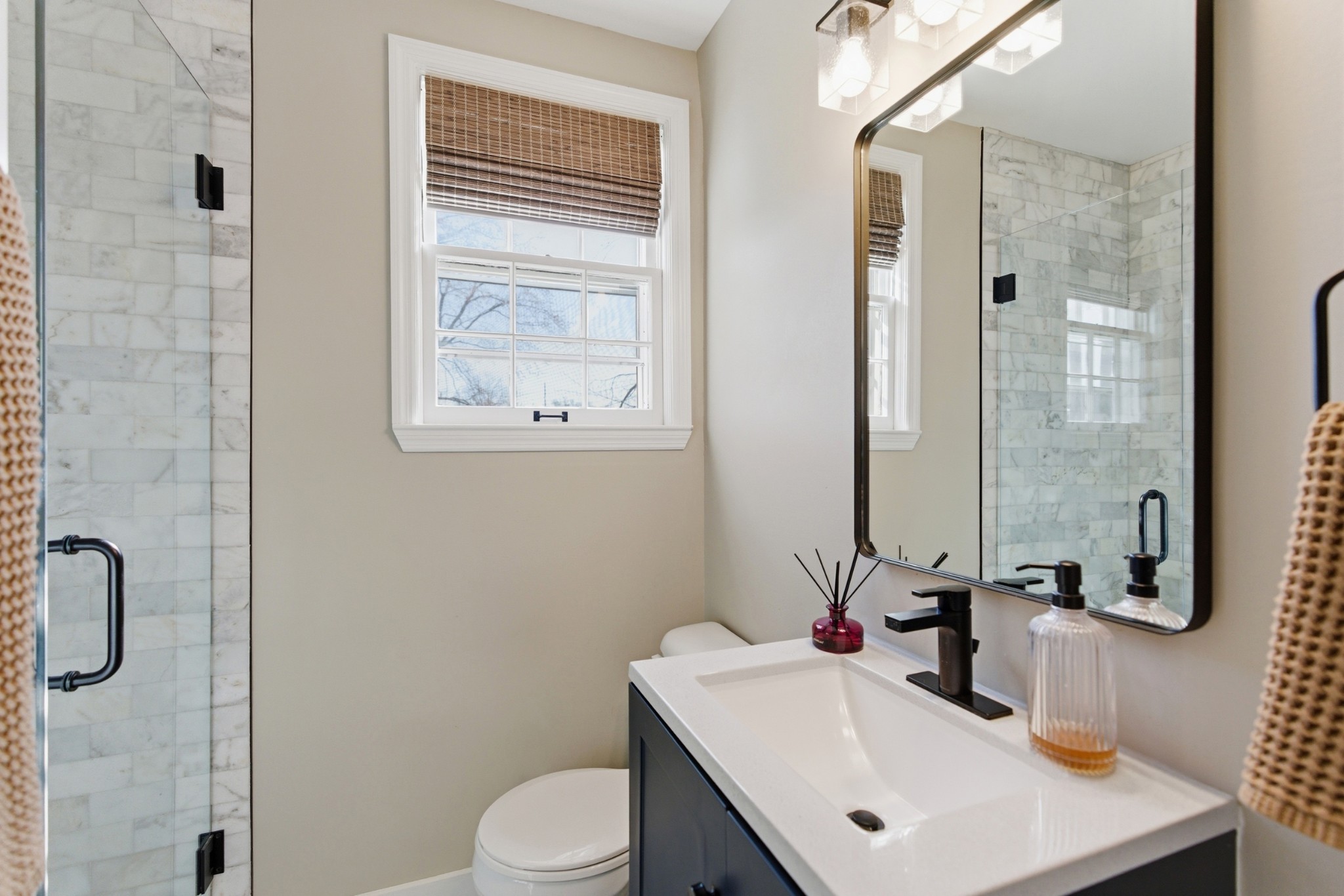 813 Bryan Street Old Hickory, TN 37138 - Photo 17 of 29 a bathroom with a sink a toilet and shower