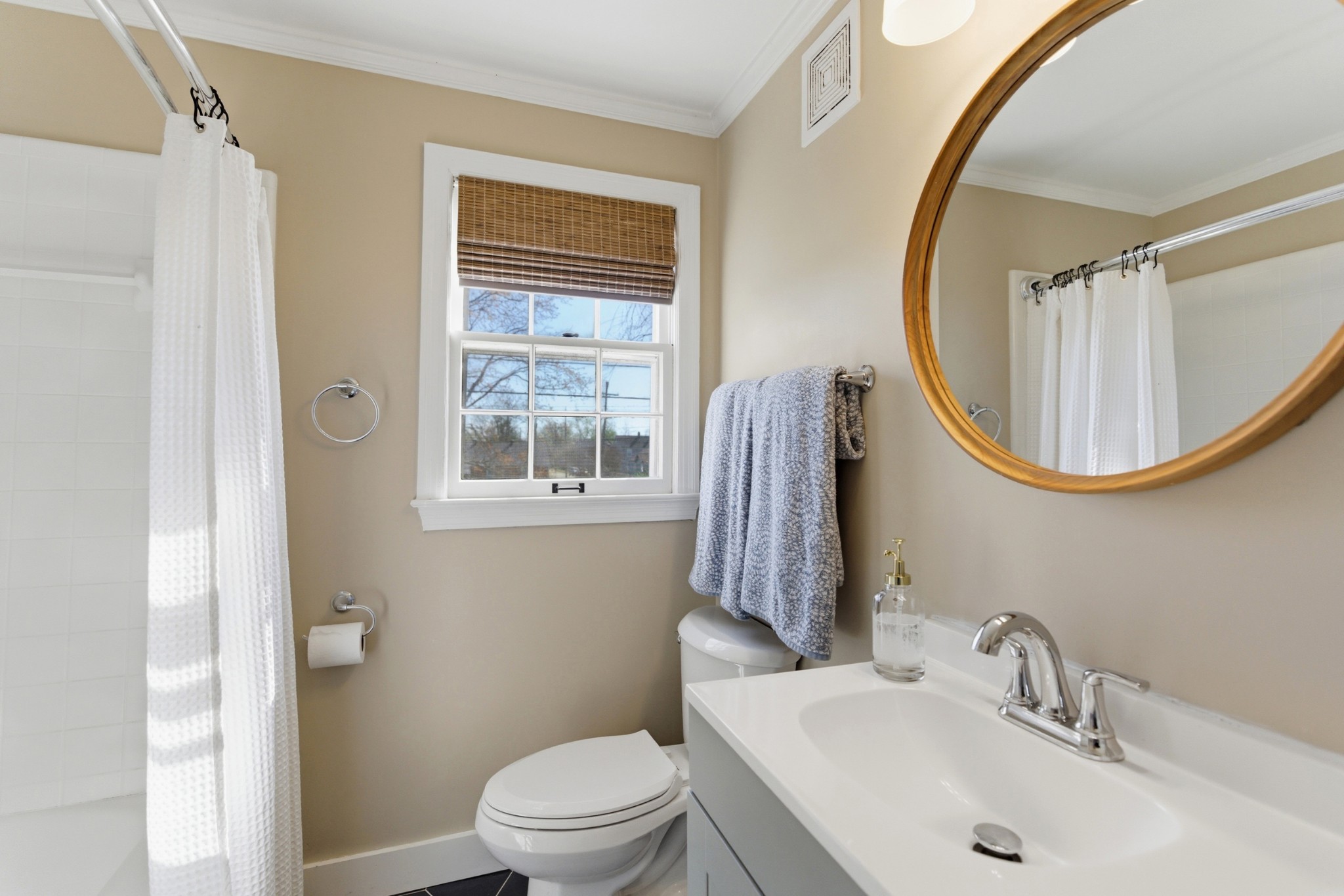 813 Bryan Street Old Hickory, TN 37138 - Photo 22 of 29 a bathroom with a sink a mirror a toilet and a window
