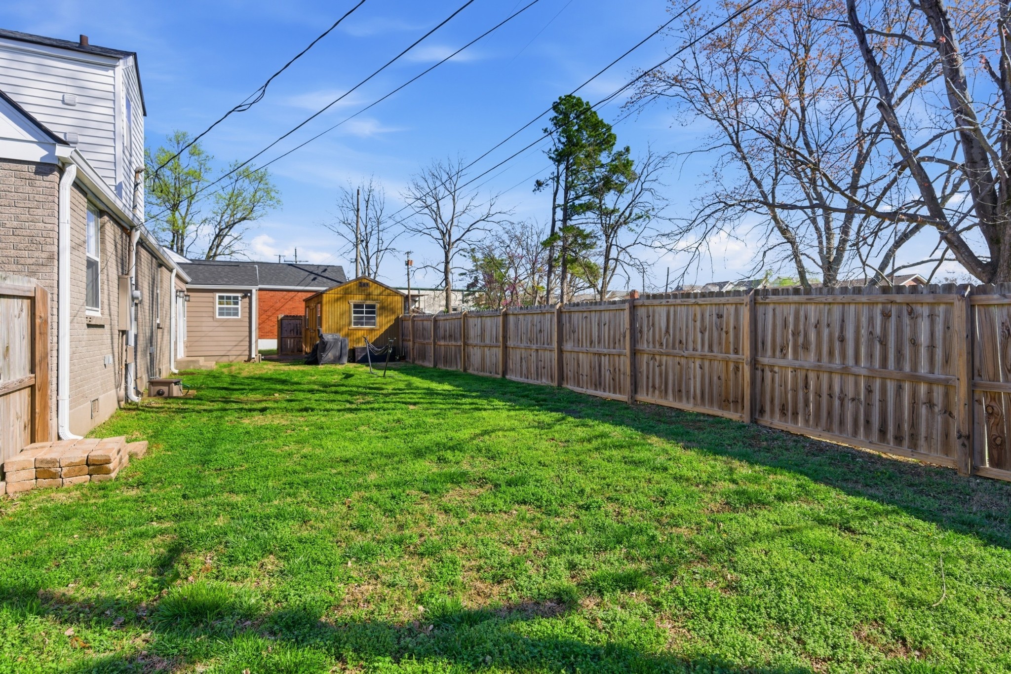 813 Bryan Street Old Hickory, TN 37138 - Photo 26 of 29 a view of a garden with a house in the background
