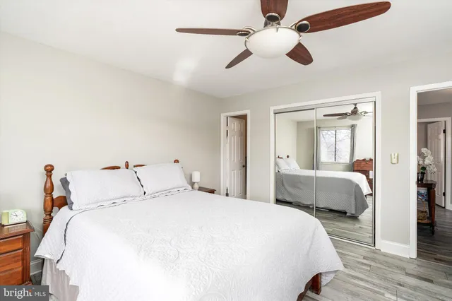 a bedroom with bed and a chandelier