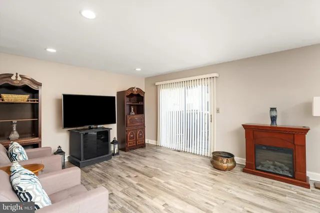 a view of a livingroom with furniture and a flat screen tv