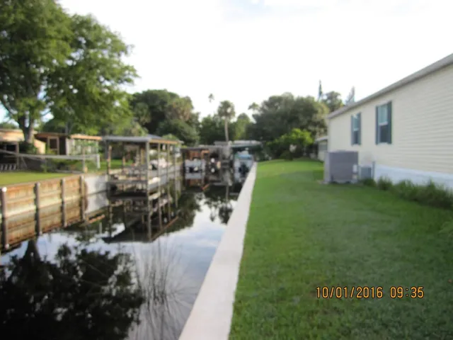 a view of a house with a big yard