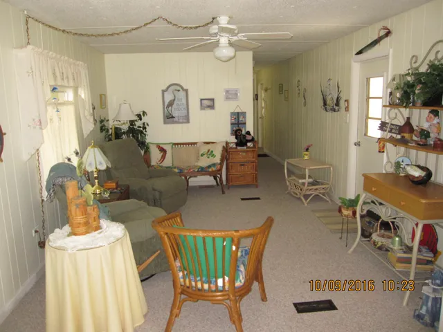 a bed sitting in a bedroom next to a lamp