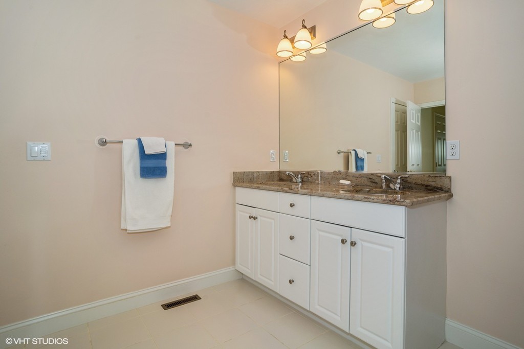68 Brookside Road, Unit 199 Bourne, MA 02532 - Photo 10 of 15 a bathroom with a sink and mirror