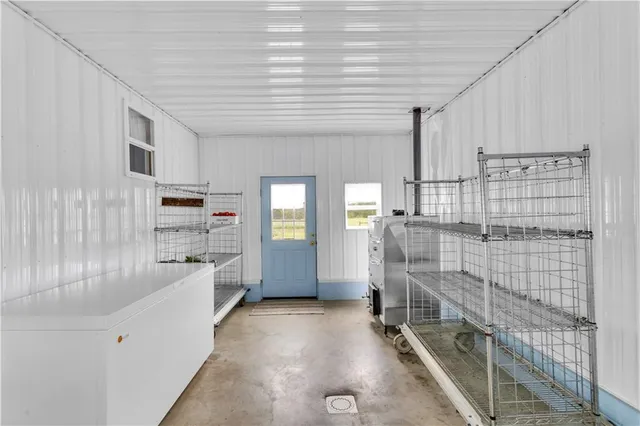 a room with walk in closet and window