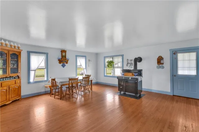 a view of a livingroom with furniture window and wooden floor
